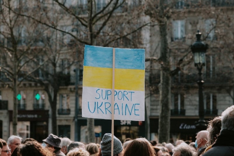 Ukraine colours above crowd of people